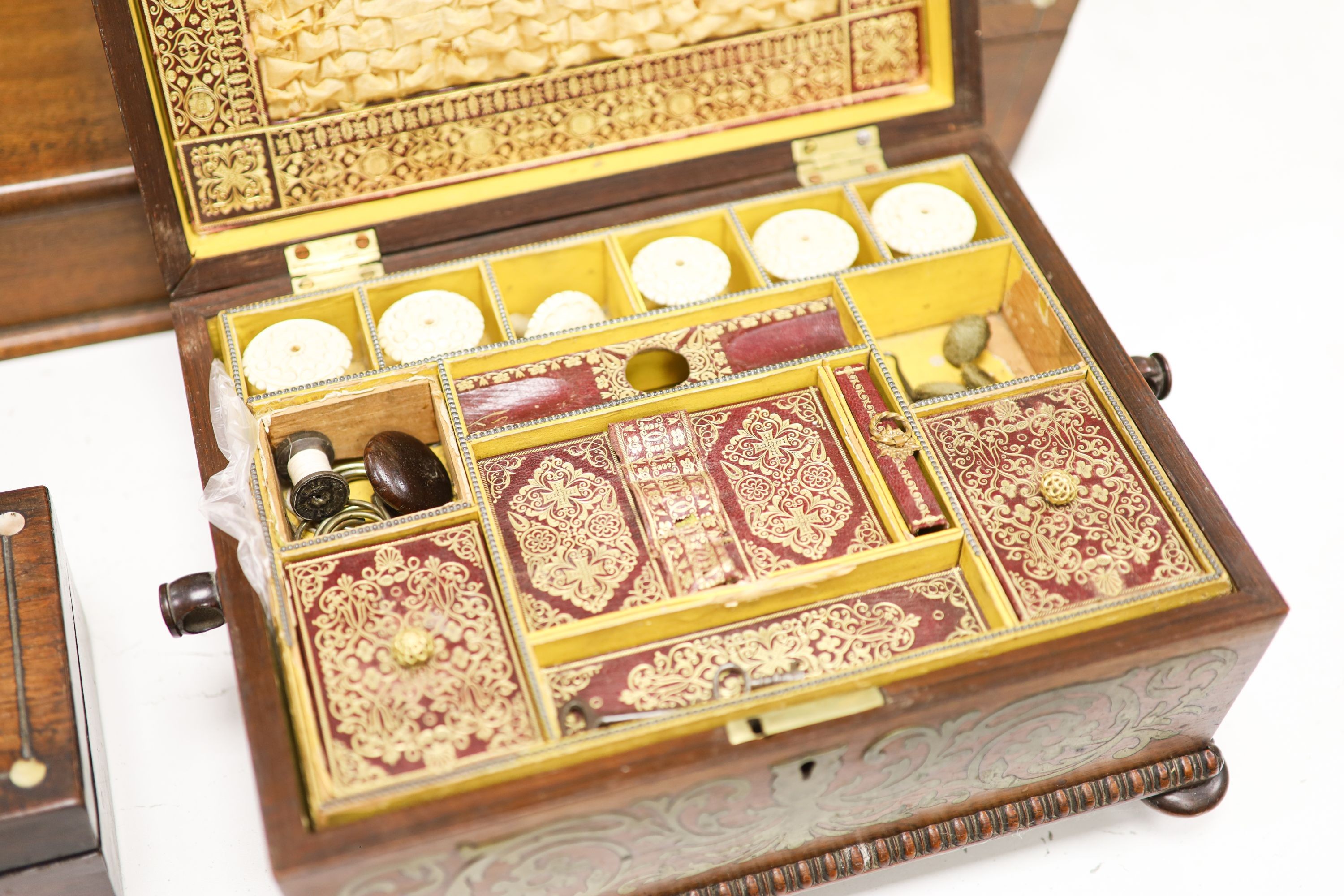 A Regency cut brass inlaid rosewood sewing box and three other boxes